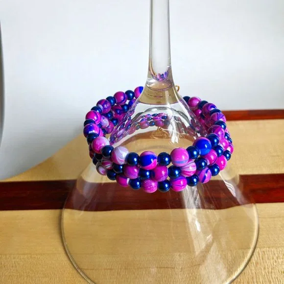 Purple and blue memory wire bracelet with gold finishing charms - Picture 2 of 3